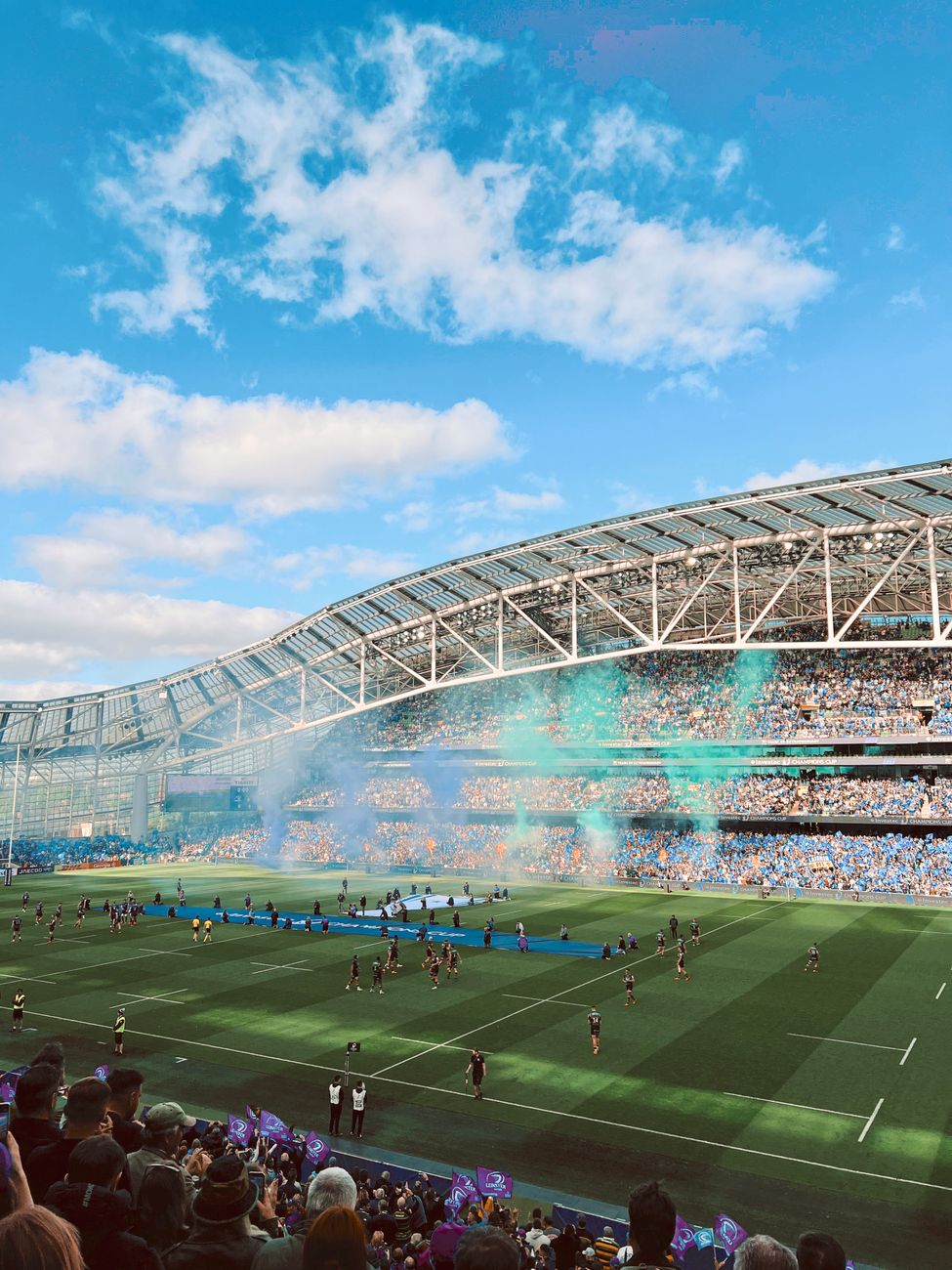 Players contesting a rugby match in a packed stadium, the spectacle Australia is using as a soft-power tool across the Pacific.