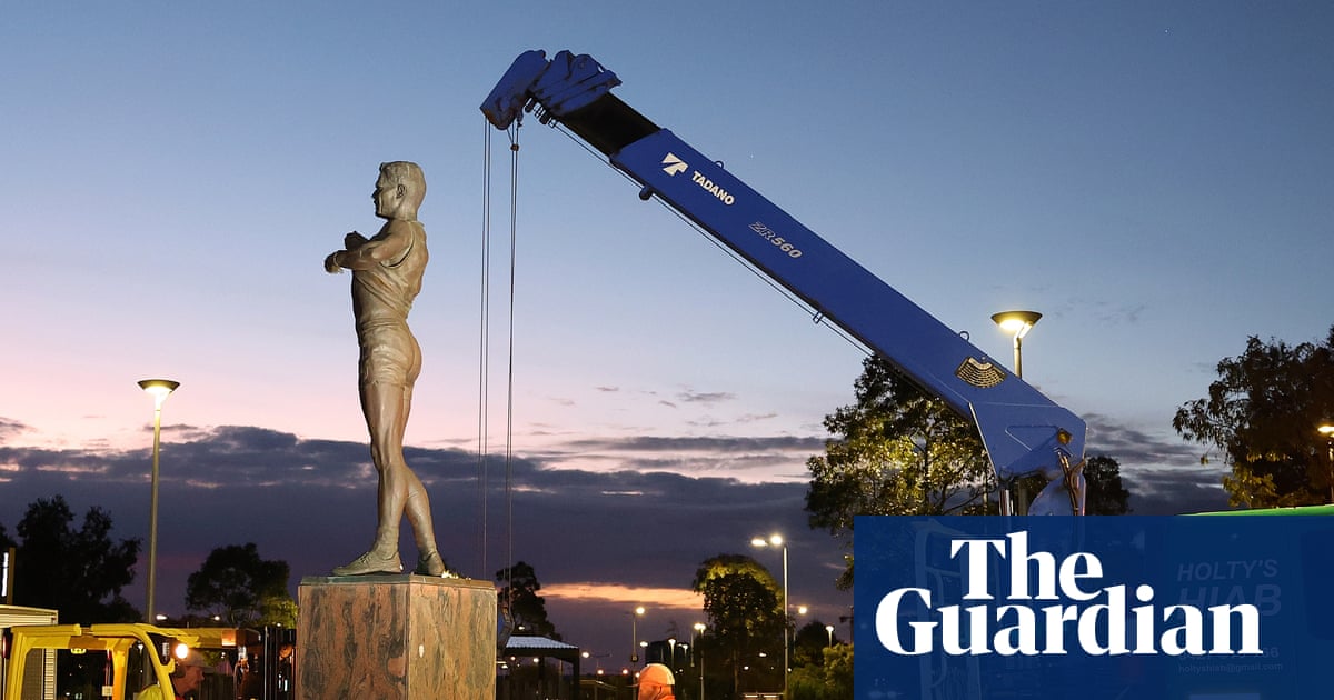 Nicky Winmar's statue honouring his response to racist abuse at a 1993 AFL match is removed from outside Optus Stadium in Perth.