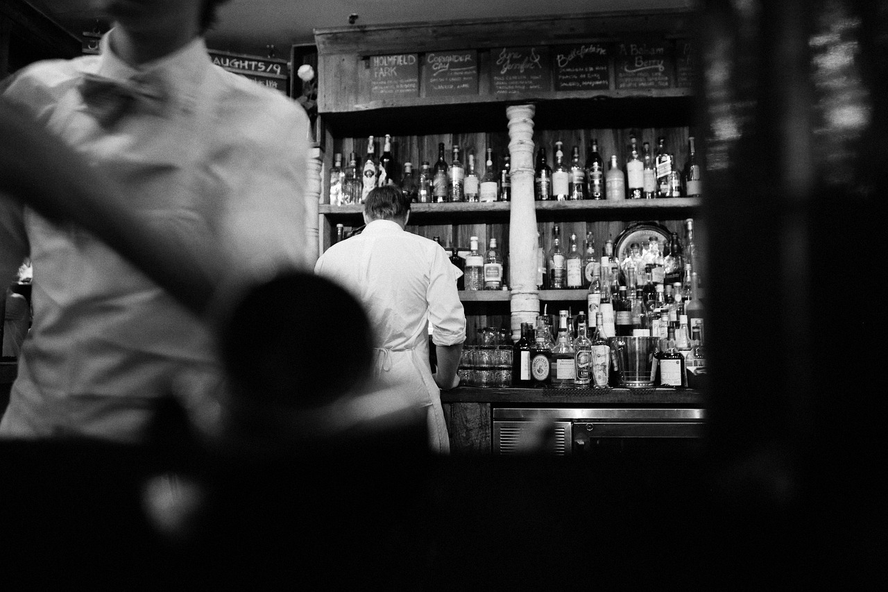 Vintage-style cocktail bar interior, matching the character-driven small-bar mood behind Ravenspur's story