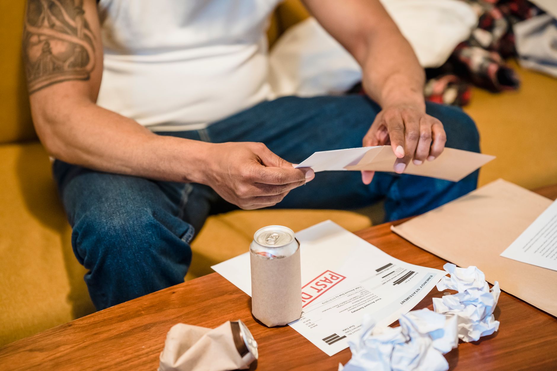 Person checking an energy bill and household paperwork.