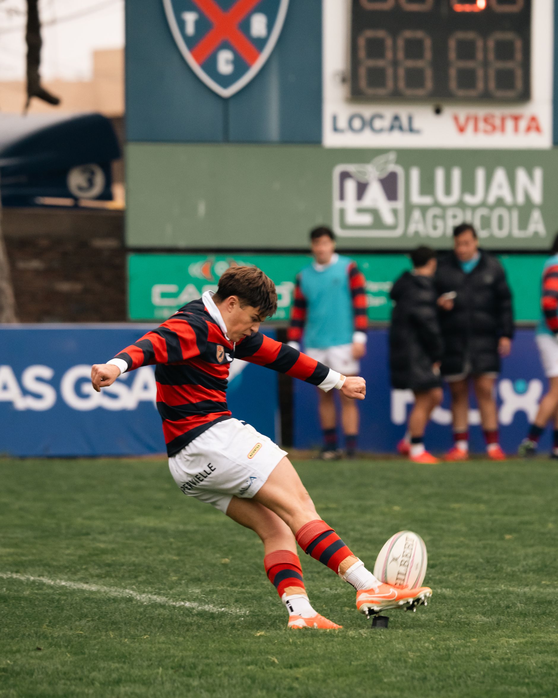 Rugby-style footballer kicking during a match, used as a generic AFL-style action image.